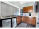 Pool house kitchenette with stainless steel counters and wood cabinets at 2505 Riverside Dr, Columbus, IN 47201
