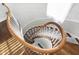 Elegant spiral staircase with wooden railing and neutral carpeting at 2505 Riverside Dr, Columbus, IN 47201
