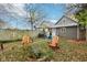 Backyard with wooden chairs, fire pit, and grill at 2028 Hoyt Ave, Indianapolis, IN 46203