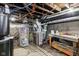 Unfinished basement with water heater and HVAC unit at 2028 Hoyt Ave, Indianapolis, IN 46203