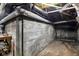 Unfinished basement showing concrete walls and pipes at 2028 Hoyt Ave, Indianapolis, IN 46203