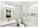 Clean bathroom with white subway tile and a bathtub at 2028 Hoyt Ave, Indianapolis, IN 46203