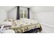 Bedroom with double bed, window, and carpet flooring at 2028 Hoyt Ave, Indianapolis, IN 46203