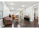 Spacious living room with hardwood floors and a view into the kitchen at 2028 Hoyt Ave, Indianapolis, IN 46203