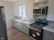 Updated kitchen with stainless steel appliances at 325 E Church St, Paragon, IN 46166