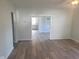 Living room with hardwood floors and view into kitchen at 325 E Church St, Paragon, IN 46166