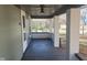 Front porch with gray concrete flooring and white columns at 325 E Church St, Paragon, IN 46166