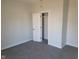 Bedroom with gray carpet, closet, and window at 325 E Church St, Paragon, IN 46166