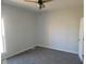 Bedroom with gray carpet, ceiling fan and window at 325 E Church St, Paragon, IN 46166