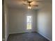 Bright bedroom with gray carpeting and large window at 325 E Church St, Paragon, IN 46166