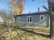Single story home with a back deck and yard at 325 E Church St, Paragon, IN 46166