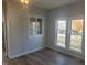 Dining area with hardwood floors and built-in window seat at 325 E Church St, Paragon, IN 46166