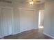 Spacious room with built-in shelving and hardwood floors at 325 E Church St, Paragon, IN 46166