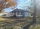 Charming single story home with front porch and landscaped yard at 325 E Church St, Paragon, IN 46166