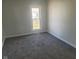 Bedroom with gray carpeting and a window at 325 E Church St, Paragon, IN 46166