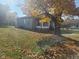 Gray siding home with a tree in the front yard at 325 E Church St, Paragon, IN 46166