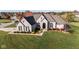 Luxury home with expansive lawn and 3-car garage, situated in a desirable neighborhood at 7610 Monte Carlo Way, Indianapolis, IN 46278