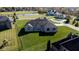 Aerial view of house showcasing large backyard and neighborhood setting at 7610 Monte Carlo Way, Indianapolis, IN 46278