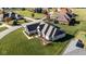 Spacious home with a large backyard and mature trees surrounding the property at 7610 Monte Carlo Way, Indianapolis, IN 46278