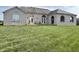 Large backyard with freshly cut lawn and beautiful landscaping at 7610 Monte Carlo Way, Indianapolis, IN 46278