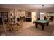 Finished basement with game area, dining table, and bar at 7610 Monte Carlo Way, Indianapolis, IN 46278