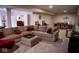 Spacious basement recreation area with sectional sofa and dining space at 7610 Monte Carlo Way, Indianapolis, IN 46278