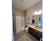 Full bathroom with tub/shower combo and dark wood vanity at 7610 Monte Carlo Way, Indianapolis, IN 46278