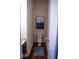 Small, simple bathroom with a toilet and wood floor at 7610 Monte Carlo Way, Indianapolis, IN 46278