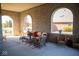 Brick patio with arched openings offering views and wicker furniture at 7610 Monte Carlo Way, Indianapolis, IN 46278
