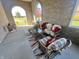 Relaxing covered patio with wicker furniture and fall decor at 7610 Monte Carlo Way, Indianapolis, IN 46278