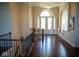 Elegant entryway with hardwood floors, a grand staircase, and high ceilings at 7610 Monte Carlo Way, Indianapolis, IN 46278