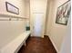 Functional entryway with bench, hooks, and wood floors at 7610 Monte Carlo Way, Indianapolis, IN 46278
