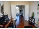 Home office with hardwood floors and view into adjacent sitting area at 7610 Monte Carlo Way, Indianapolis, IN 46278