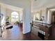 Sunlit home office features hardwood floors and built-in shelving at 7610 Monte Carlo Way, Indianapolis, IN 46278
