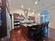 Spacious kitchen boasts dark wood cabinets, granite counters, and stainless steel appliances at 7610 Monte Carlo Way, Indianapolis, IN 46278