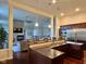 Open kitchen with large island, granite countertops, and stainless steel appliances at 7610 Monte Carlo Way, Indianapolis, IN 46278