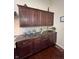 Dark wood cabinets and granite countertops in kitchen at 7610 Monte Carlo Way, Indianapolis, IN 46278