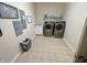 Bright laundry room with washer, dryer, and ample storage at 7610 Monte Carlo Way, Indianapolis, IN 46278
