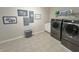 Bright laundry room with washer, dryer, and ample storage at 7610 Monte Carlo Way, Indianapolis, IN 46278