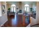 Open living area with hardwood floors, fireplace, and access to backyard at 7610 Monte Carlo Way, Indianapolis, IN 46278