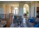 Open concept living space with hardwood floors, a fireplace, and views into the dining room at 7610 Monte Carlo Way, Indianapolis, IN 46278