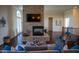 Living room featuring a large stone fireplace and hardwood floors at 7610 Monte Carlo Way, Indianapolis, IN 46278