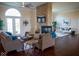 Spacious living room with a stone fireplace, hardwood floors, and ample seating at 7610 Monte Carlo Way, Indianapolis, IN 46278