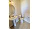 Small powder room with pedestal sink, toilet and tile floor at 7610 Monte Carlo Way, Indianapolis, IN 46278