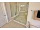 Walk-in shower with built-in seat and glass enclosure at 7610 Monte Carlo Way, Indianapolis, IN 46278
