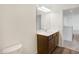 Bathroom with a vanity with wood cabinets and a large mirror at 5856 Fair Oak Cir, Brownsburg, IN 46112