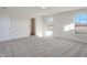 Bright bedroom with carpet, large windows, and access to bathroom at 5856 Fair Oak Cir, Brownsburg, IN 46112