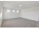 Well-lit bedroom featuring carpet flooring and multiple windows at 5856 Fair Oak Cir, Brownsburg, IN 46112