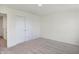Simple bedroom with neutral walls, carpet and double doors to closet at 5856 Fair Oak Cir, Brownsburg, IN 46112