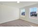 Bright bedroom with neutral walls, carpet and two windows at 5856 Fair Oak Cir, Brownsburg, IN 46112